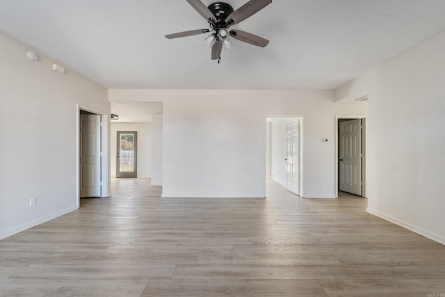 unfurnished room featuring light hardwood / wood-style floors and ceiling fan