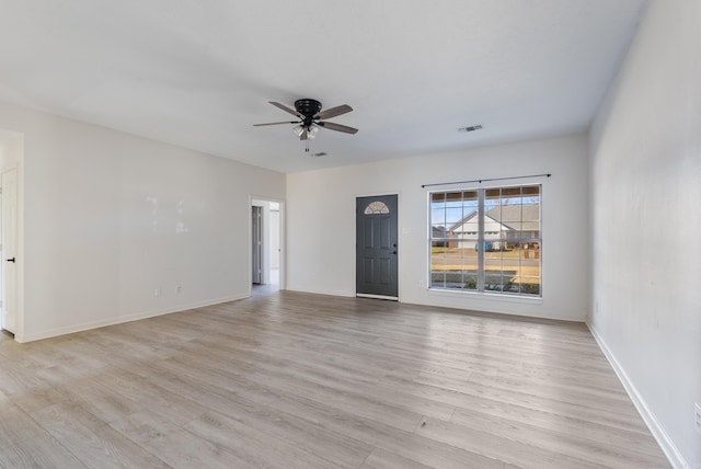 unfurnished room with ceiling fan and light hardwood / wood-style floors