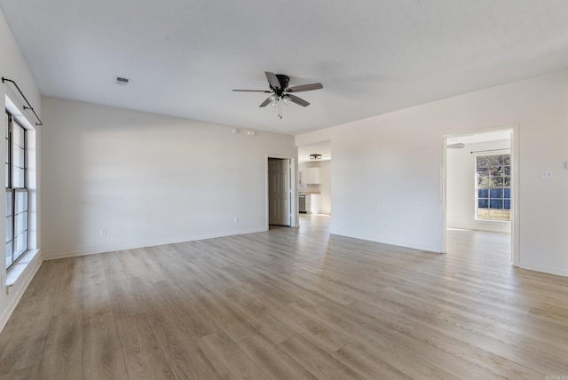 unfurnished room featuring ceiling fan and light hardwood / wood-style floors