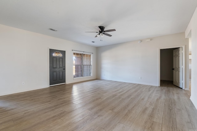 unfurnished room with ceiling fan and light hardwood / wood-style flooring