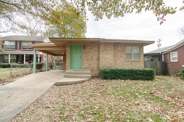 view of front of home featuring a carport