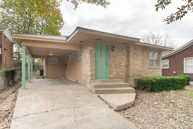 view of front facade with a carport