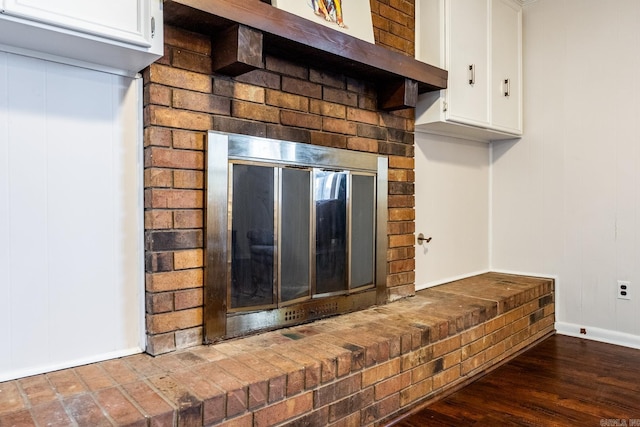 details with a fireplace and hardwood / wood-style flooring