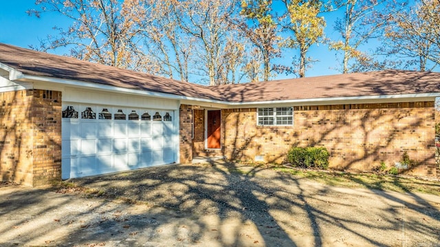 ranch-style house featuring a garage