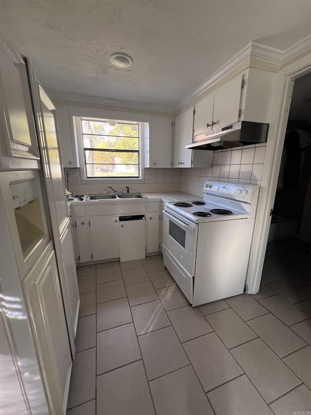 kitchen featuring white appliances, white cabinets, sink, a textured ceiling, and tasteful backsplash