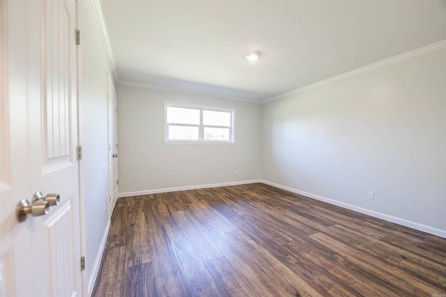 unfurnished room featuring dark hardwood / wood-style floors and crown molding