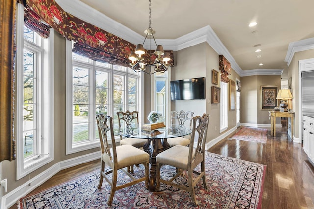 dining room with dark hardwood / wood-style flooring, ornamental molding, and a notable chandelier