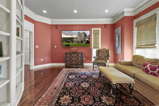 living room with dark hardwood / wood-style floors and ornamental molding