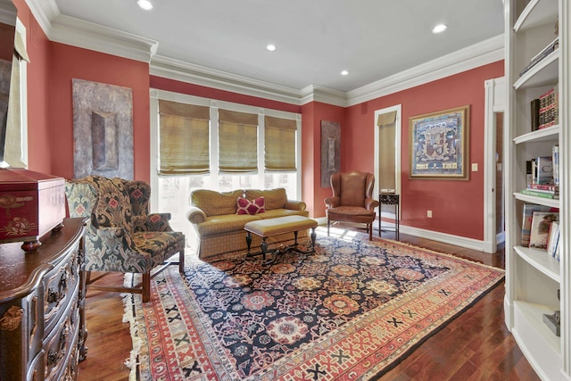 sitting room with dark hardwood / wood-style flooring and ornamental molding