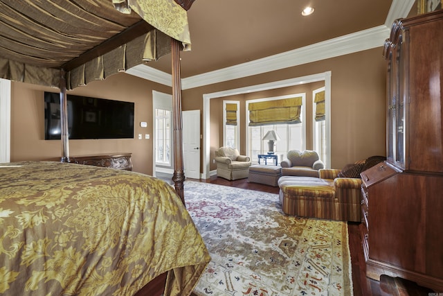 bedroom with dark hardwood / wood-style floors and ornamental molding