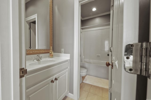 full bathroom with vanity, washtub / shower combination, tile patterned flooring, toilet, and ornamental molding