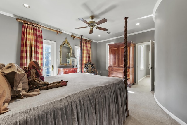 carpeted bedroom featuring ceiling fan and crown molding