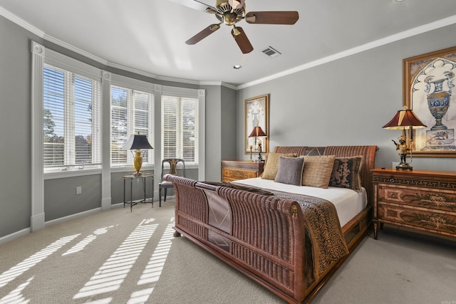 bedroom with ceiling fan, light carpet, and ornamental molding