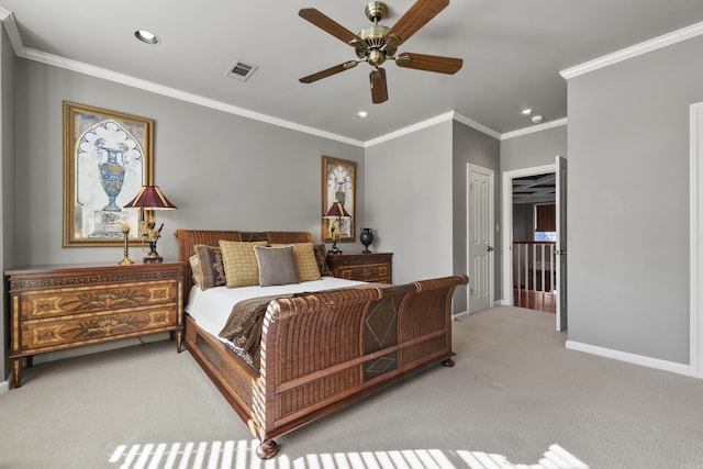 carpeted bedroom with a closet, ceiling fan, and ornamental molding