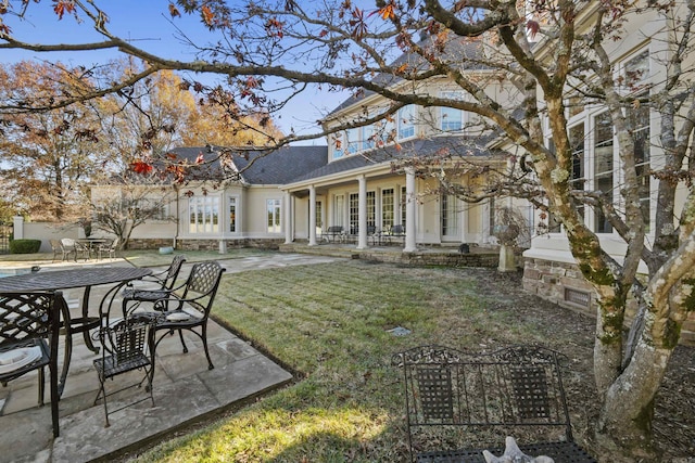 view of yard with french doors and a patio area