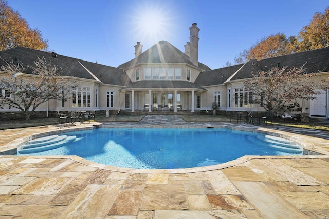 view of pool featuring a patio