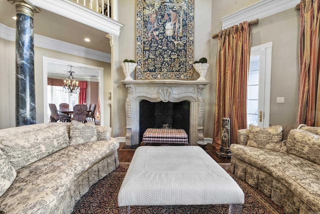 living room featuring a notable chandelier, dark hardwood / wood-style flooring, and crown molding