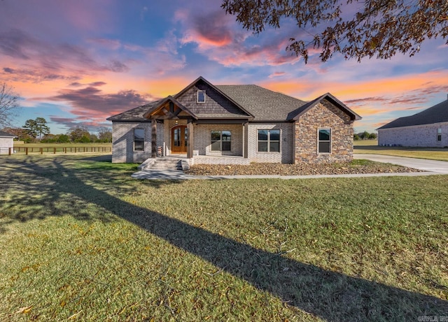 craftsman inspired home featuring a lawn