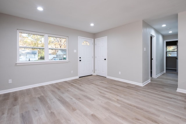 entryway with light hardwood / wood-style flooring