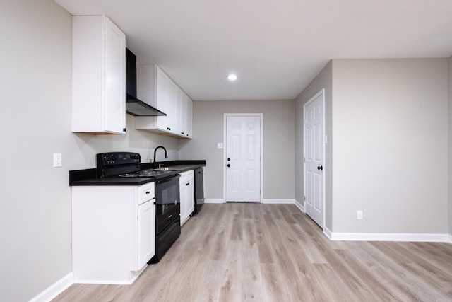 kitchen with wall chimney exhaust hood, white cabinetry, light wood-type flooring, and black electric range