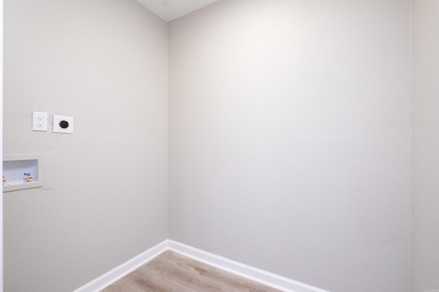 washroom with washer hookup, electric dryer hookup, and light hardwood / wood-style flooring