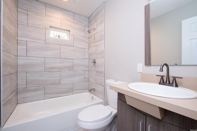 full bathroom with vanity, toilet, and tiled shower / bath