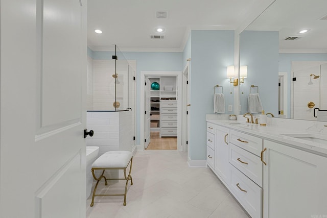 bathroom with vanity, a shower with door, and ornamental molding