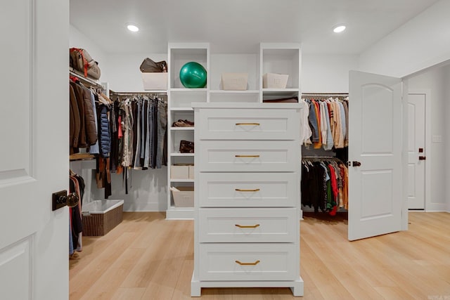 walk in closet featuring light hardwood / wood-style floors