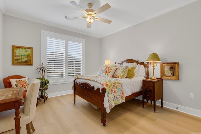 bedroom with ceiling fan, crown molding, and light hardwood / wood-style floors