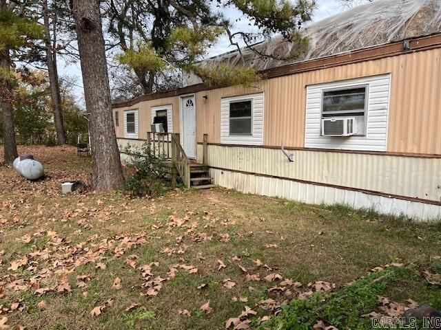 view of front of property with cooling unit