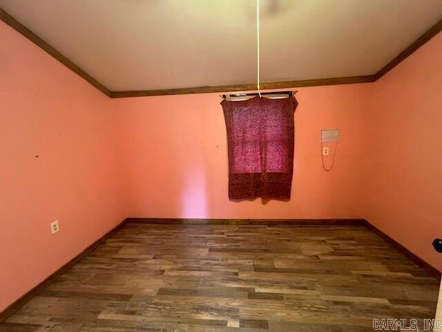 unfurnished dining area with wood-type flooring and ornamental molding