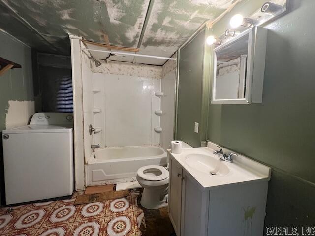 full bathroom with washer / clothes dryer, shower / bathing tub combination, vanity, and toilet