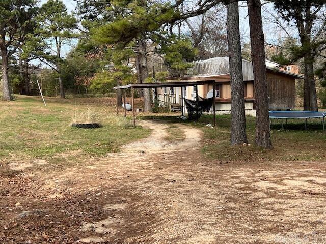 view of yard with a trampoline