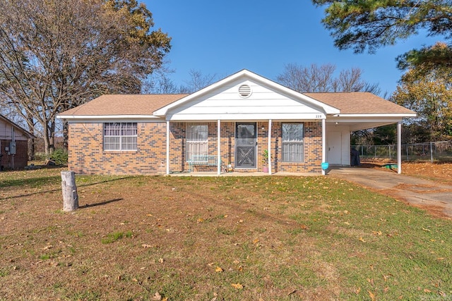 ranch-style house with a front yard and a carport