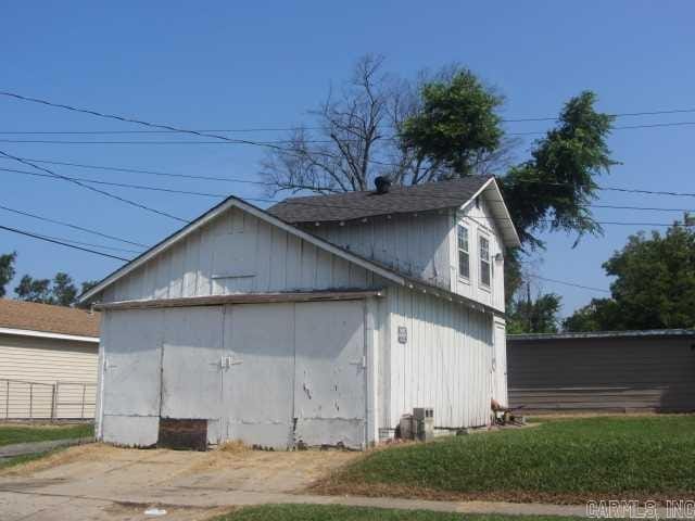 view of side of property with fence