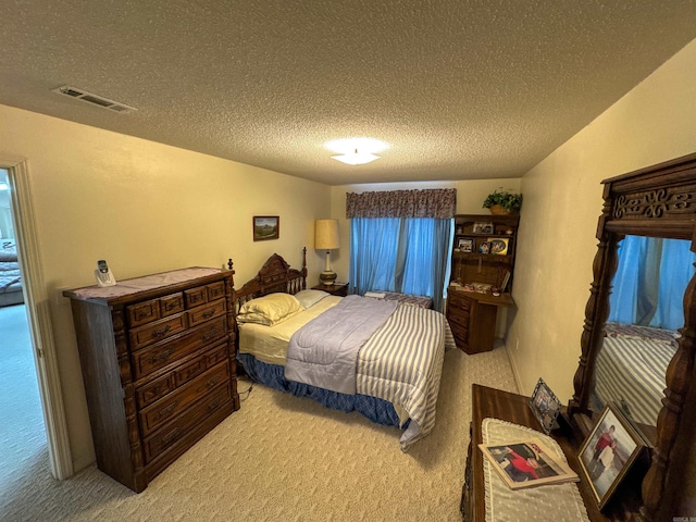 carpeted bedroom with a textured ceiling