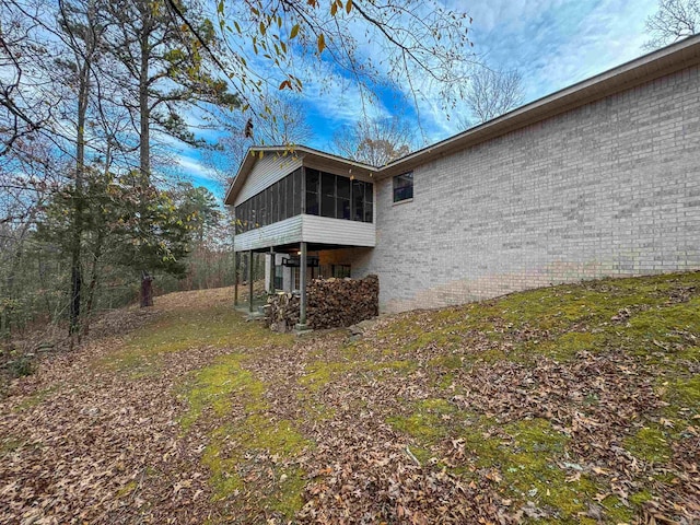 rear view of house with a sunroom