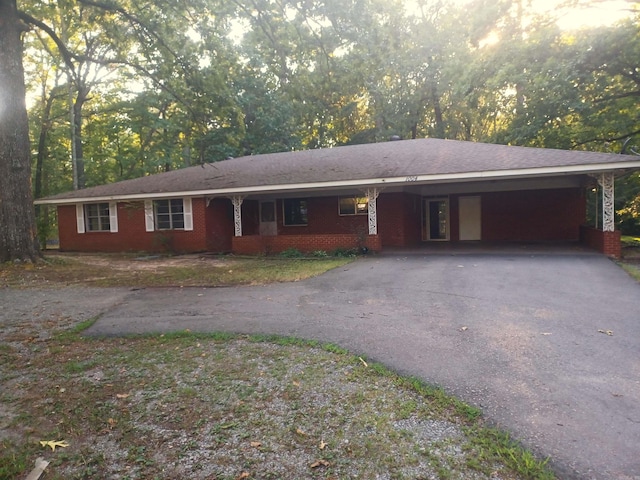 ranch-style house with a carport