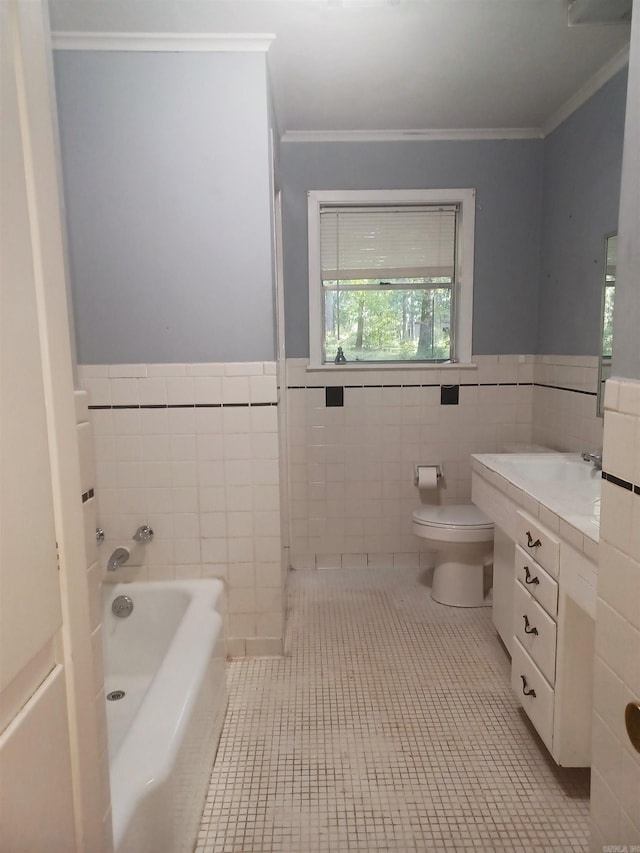 bathroom with tile patterned flooring, vanity, a bathtub, and tile walls