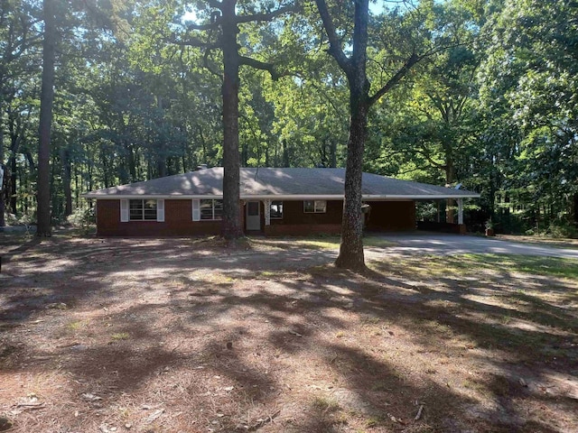 view of front of property featuring a carport