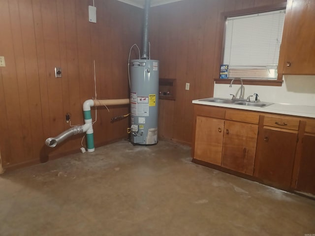 utility room with sink and water heater