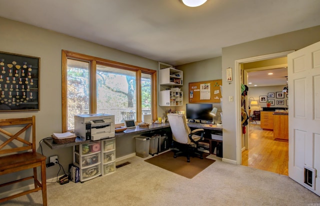 home office with light wood-type flooring