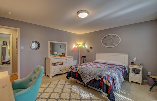 bedroom featuring light carpet