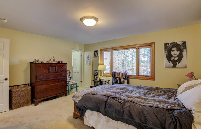 bedroom with light colored carpet