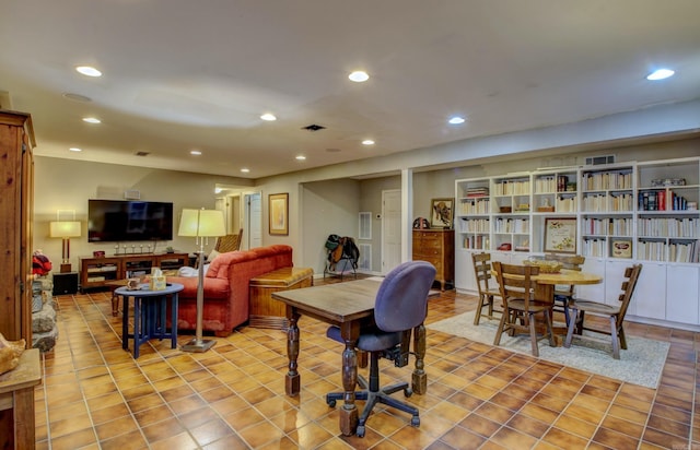 dining space featuring light tile patterned flooring