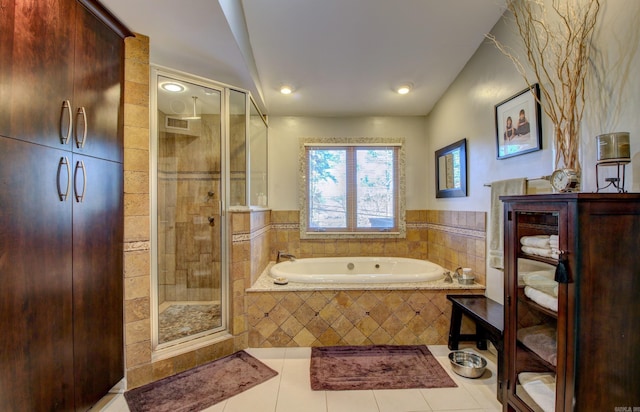 bathroom with separate shower and tub and tile patterned flooring