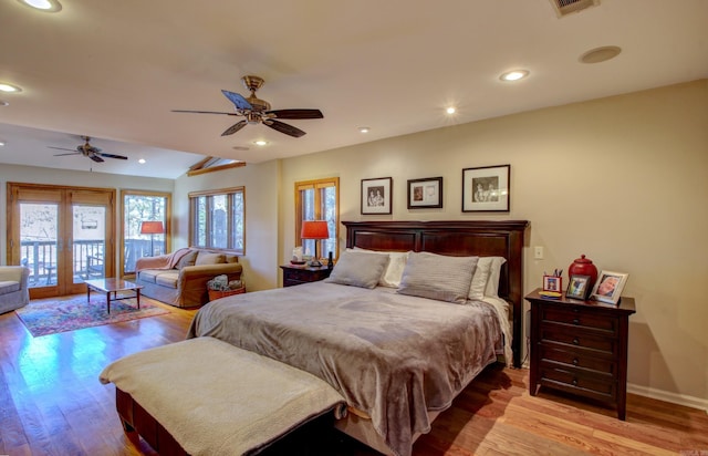 bedroom featuring ceiling fan, light hardwood / wood-style floors, and access to exterior