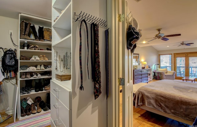 bedroom featuring hardwood / wood-style flooring and ceiling fan