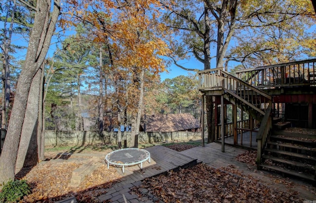 wooden deck with a trampoline