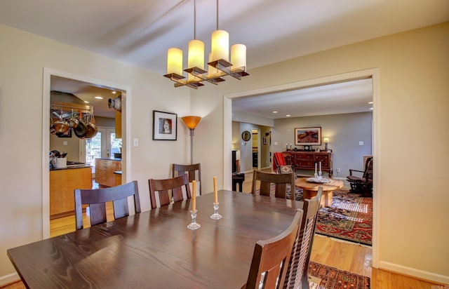 dining area featuring a chandelier and hardwood / wood-style flooring